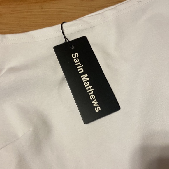 Short white dress, it is longer in the back, size large, never worn. - Picture 2 of 2